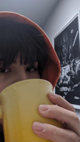 Katrina drinking from large mug